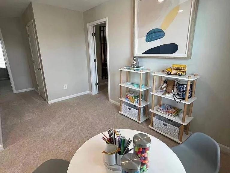 115 Wynn Way Pendergrass, GA 30567 - Photo 17 of 22 a living room with furniture and a book shelf