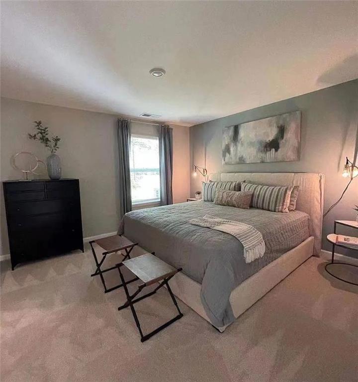 115 Wynn Way Pendergrass, GA 30567 - Photo 10 of 22 a bedroom with a bed and window