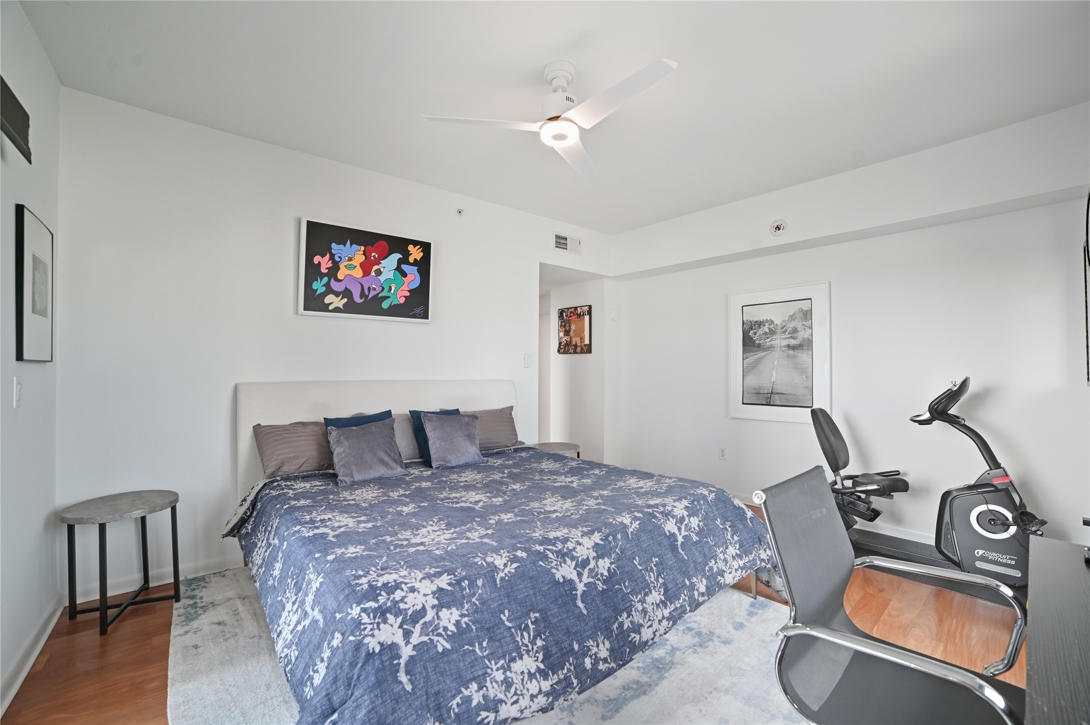 54 Rainey Street, Unit 1018 Austin, TX 78701 - Photo 16 of 32 a bedroom with a bed and a dresser with rug
