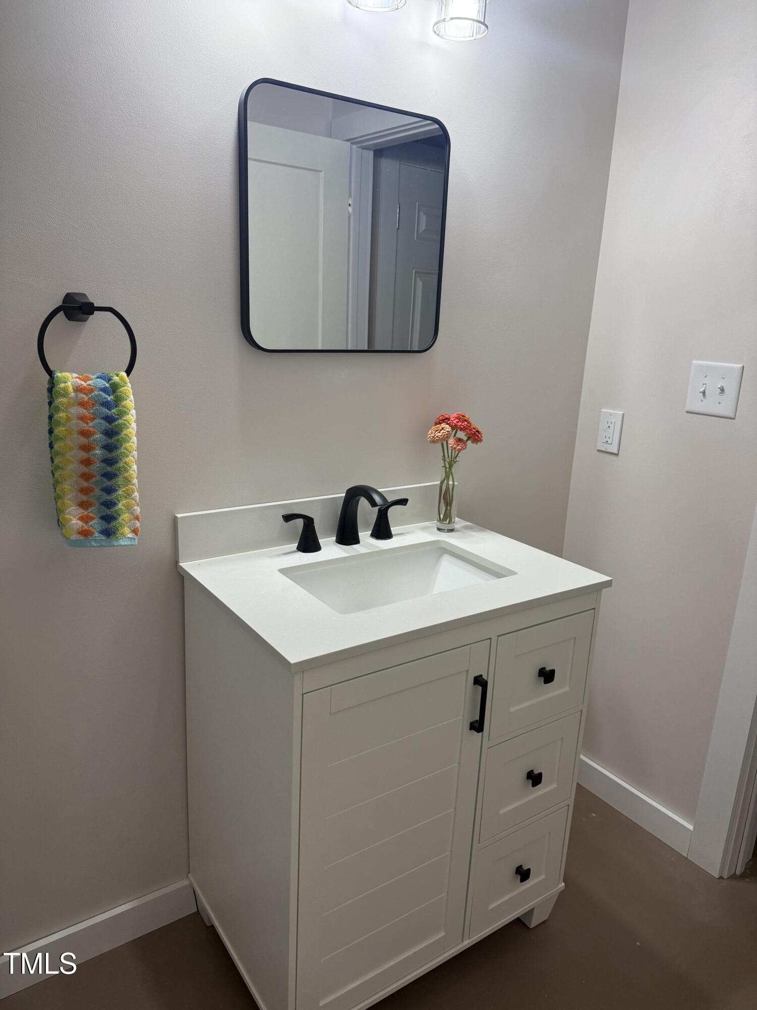 405 Sam Allen Road Roper, NC 27970 - Photo 13 of 32 a bathroom with a sink and a mirror