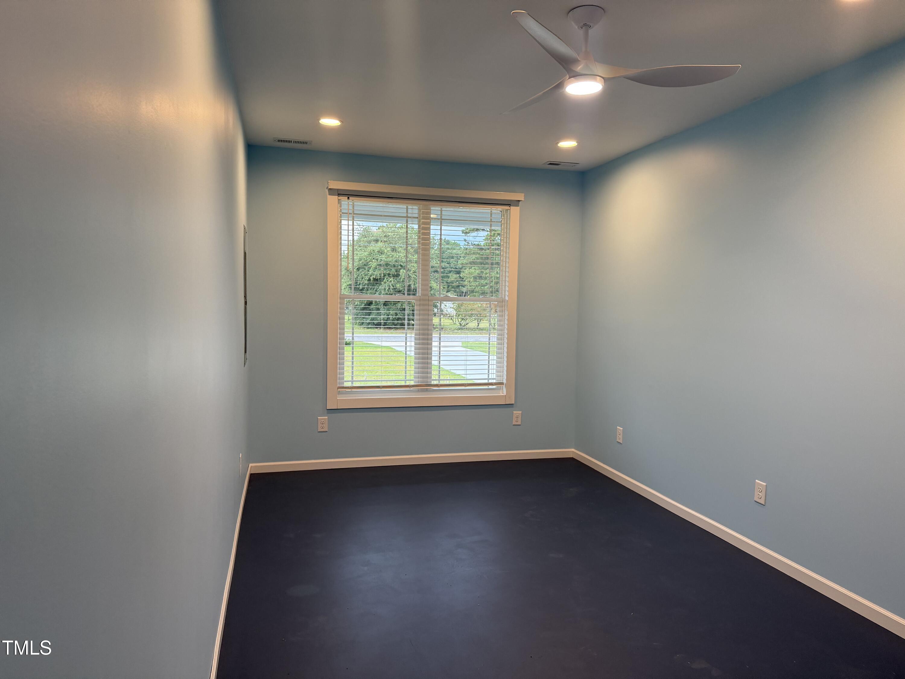405 Sam Allen Road Roper, NC 27970 - Photo 14 of 32 an empty room with wooden floor and windows