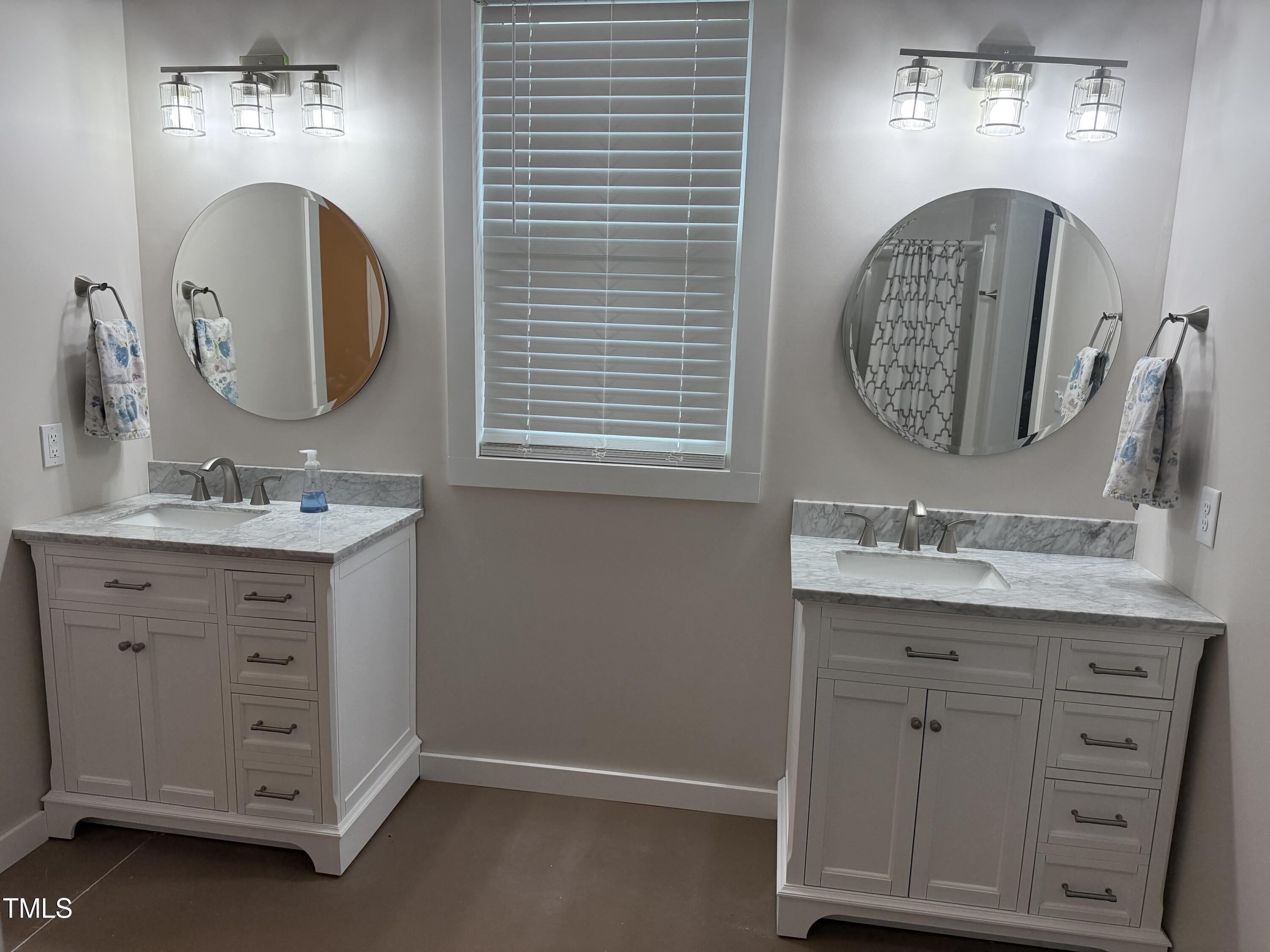 405 Sam Allen Road Roper, NC 27970 - Photo 21 of 32 a bathroom with a sink mirror and vanity