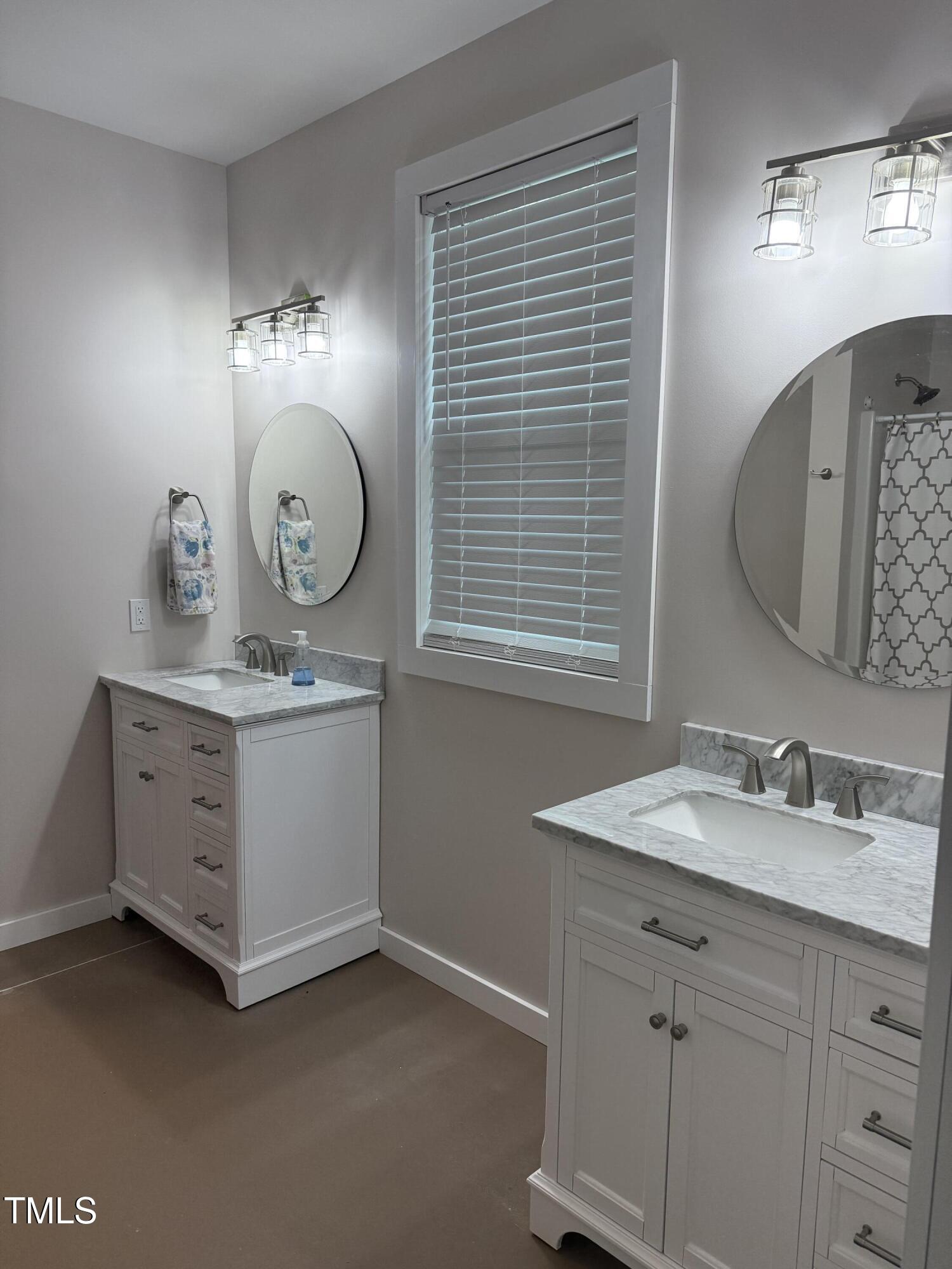 405 Sam Allen Road Roper, NC 27970 - Photo 23 of 32 a bathroom with a granite countertop sink and a mirror