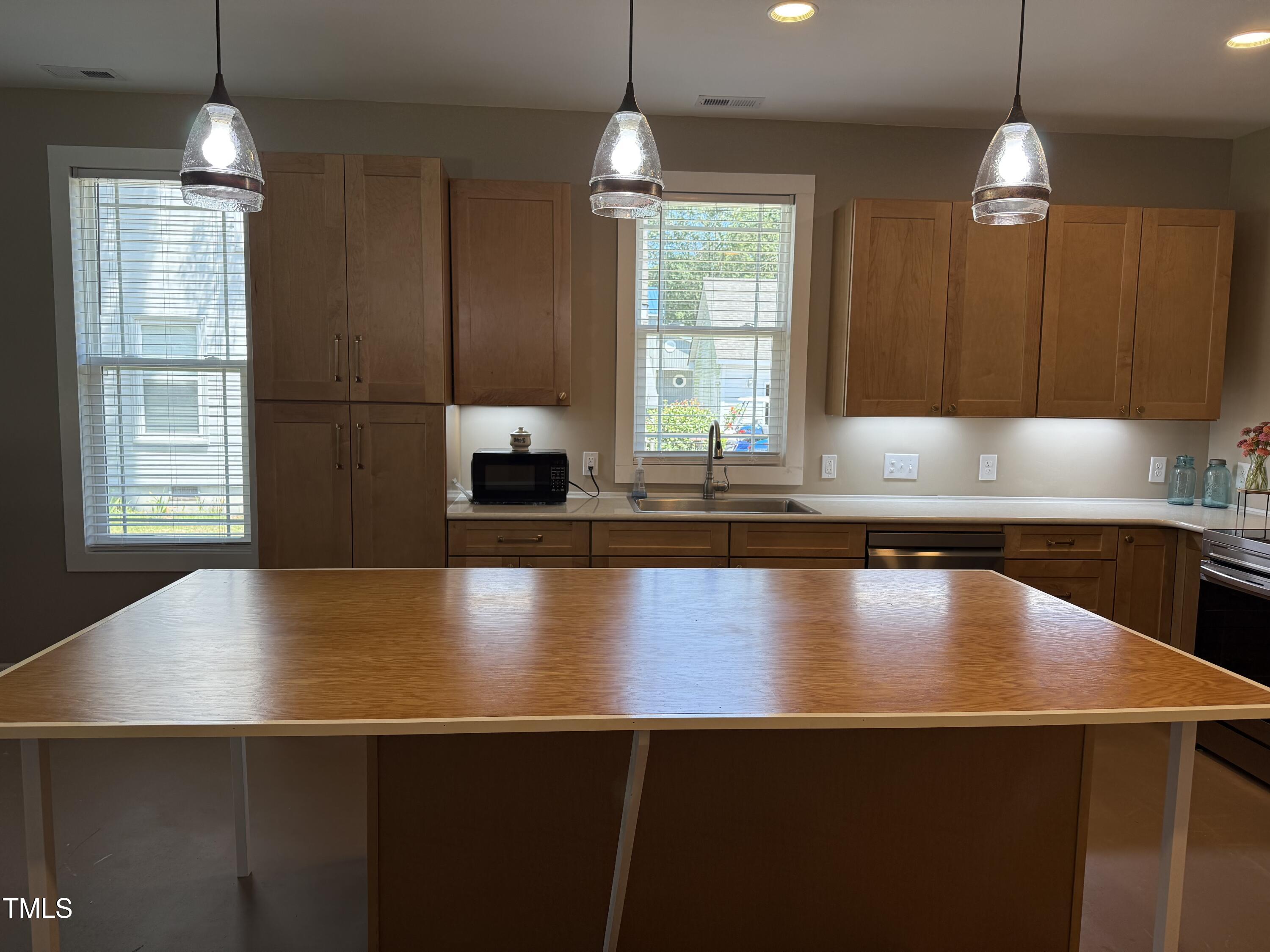 405 Sam Allen Road Roper, NC 27970 - Photo 6 of 32 a kitchen with a table chairs and a window