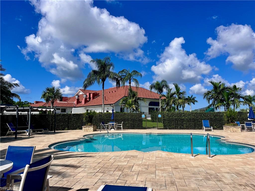 3685 Amberly Circle, Unit D305 Naples, FL 34112 - Photo 35 of 42 a view of swimming pool with outdoor seating