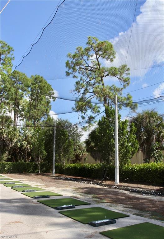 3685 Amberly Circle, Unit D305 Naples, FL 34112 - Photo 40 of 42 a view of a yard in front of a building