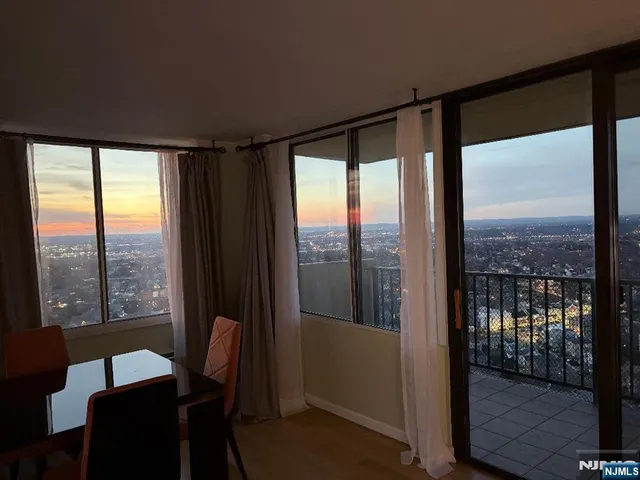 a view of a city from a big room with balcony