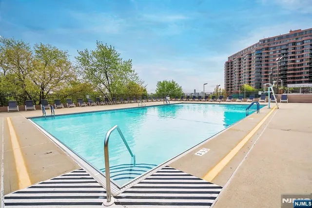 a view of swimming pool with outdoor space and seating area