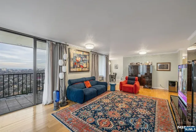 a bed room with furniture and a flat screen tv