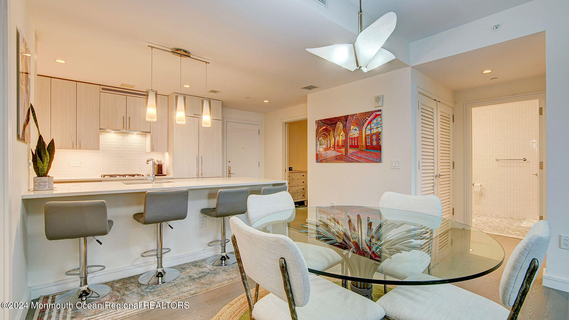 15 Morris Avenue, Unit 307 Long Branch, NJ 07740 - Photo 11 of 33 a kitchen with a table and chairs