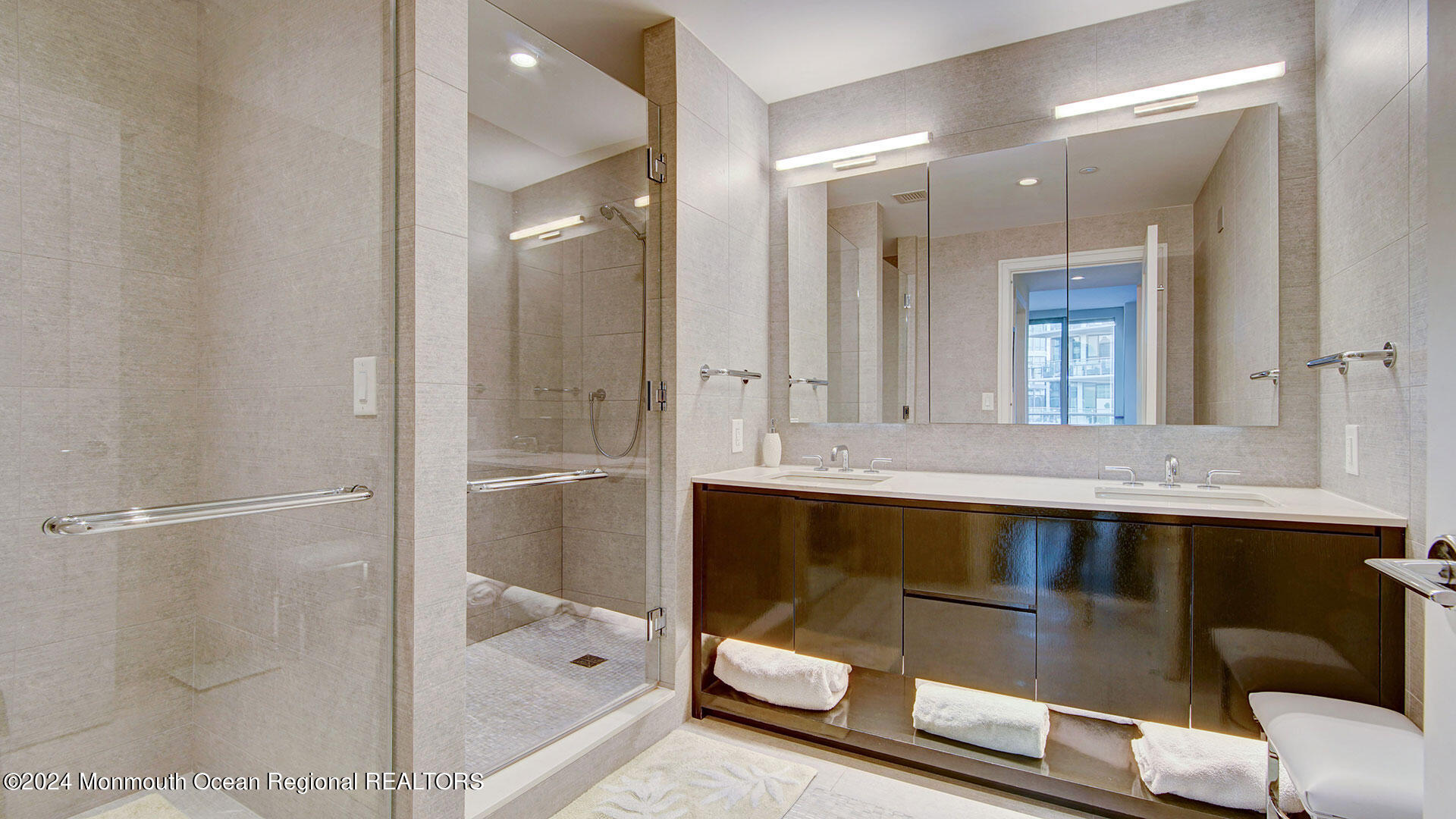 15 Morris Avenue, Unit 307 Long Branch, NJ 07740 - Photo 23 of 33 a bathroom with a sink and a mirror