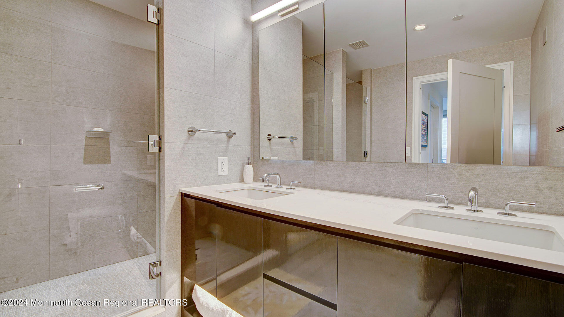 15 Morris Avenue, Unit 307 Long Branch, NJ 07740 - Photo 24 of 33 a bathroom with a sink and a mirror