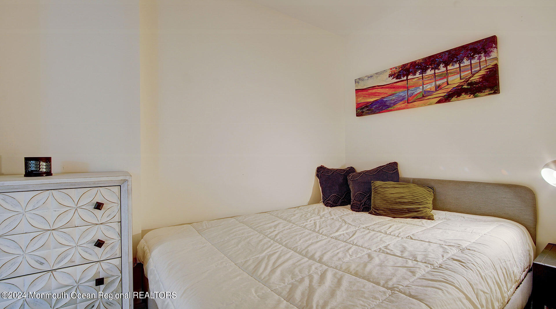 15 Morris Avenue, Unit 307 Long Branch, NJ 07740 - Photo 26 of 33 a bedroom with a bed and a window