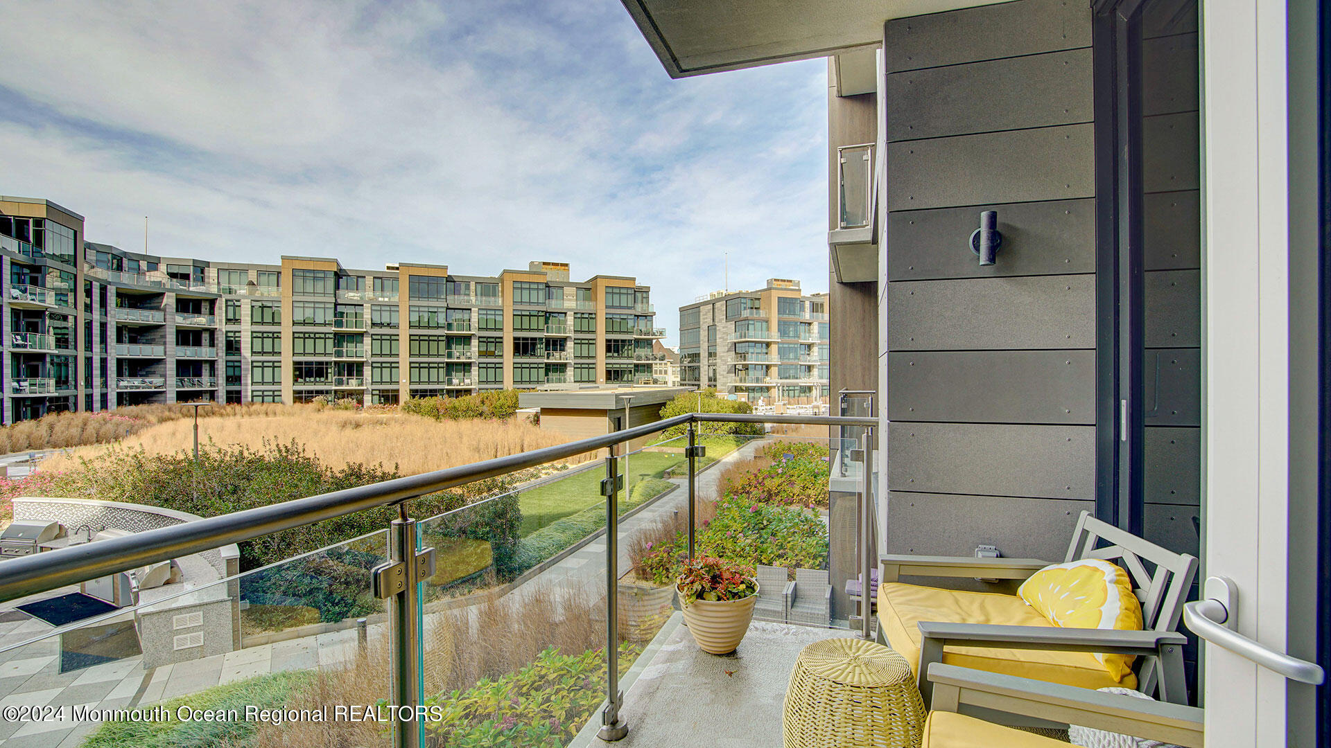 15 Morris Avenue, Unit 307 Long Branch, NJ 07740 - Photo 27 of 33 a view of a balcony with dining table and chairs