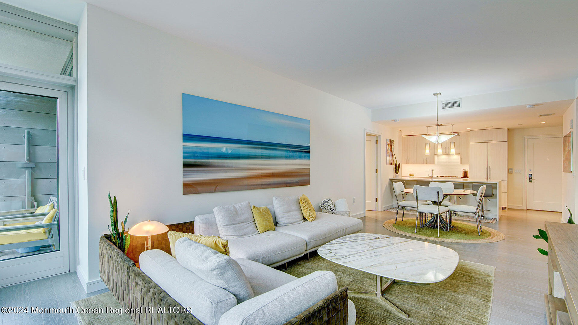 15 Morris Avenue, Unit 307 Long Branch, NJ 07740 - Photo 3 of 33 a living room with furniture and a chandelier