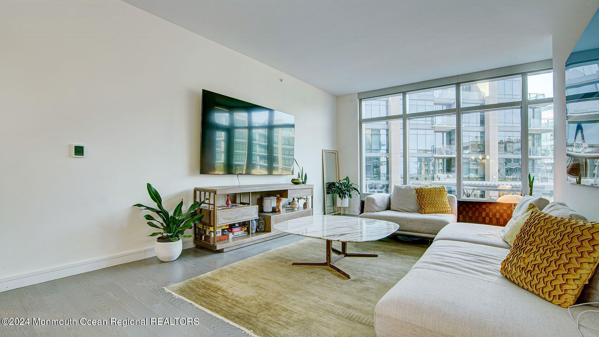 15 Morris Avenue, Unit 307 Long Branch, NJ 07740 - Photo 5 of 33 a living room with furniture and a large window