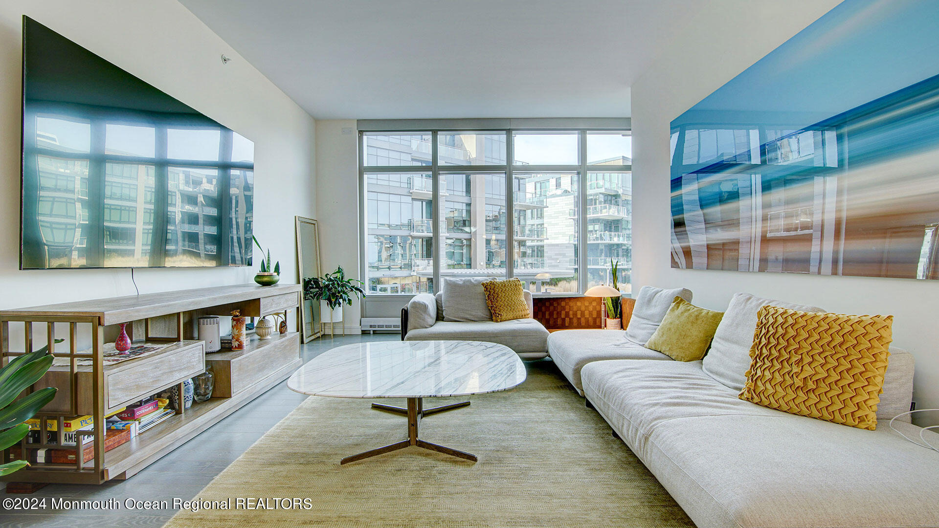 15 Morris Avenue, Unit 307 Long Branch, NJ 07740 - Photo 6 of 33 a living room with furniture and a book shelf