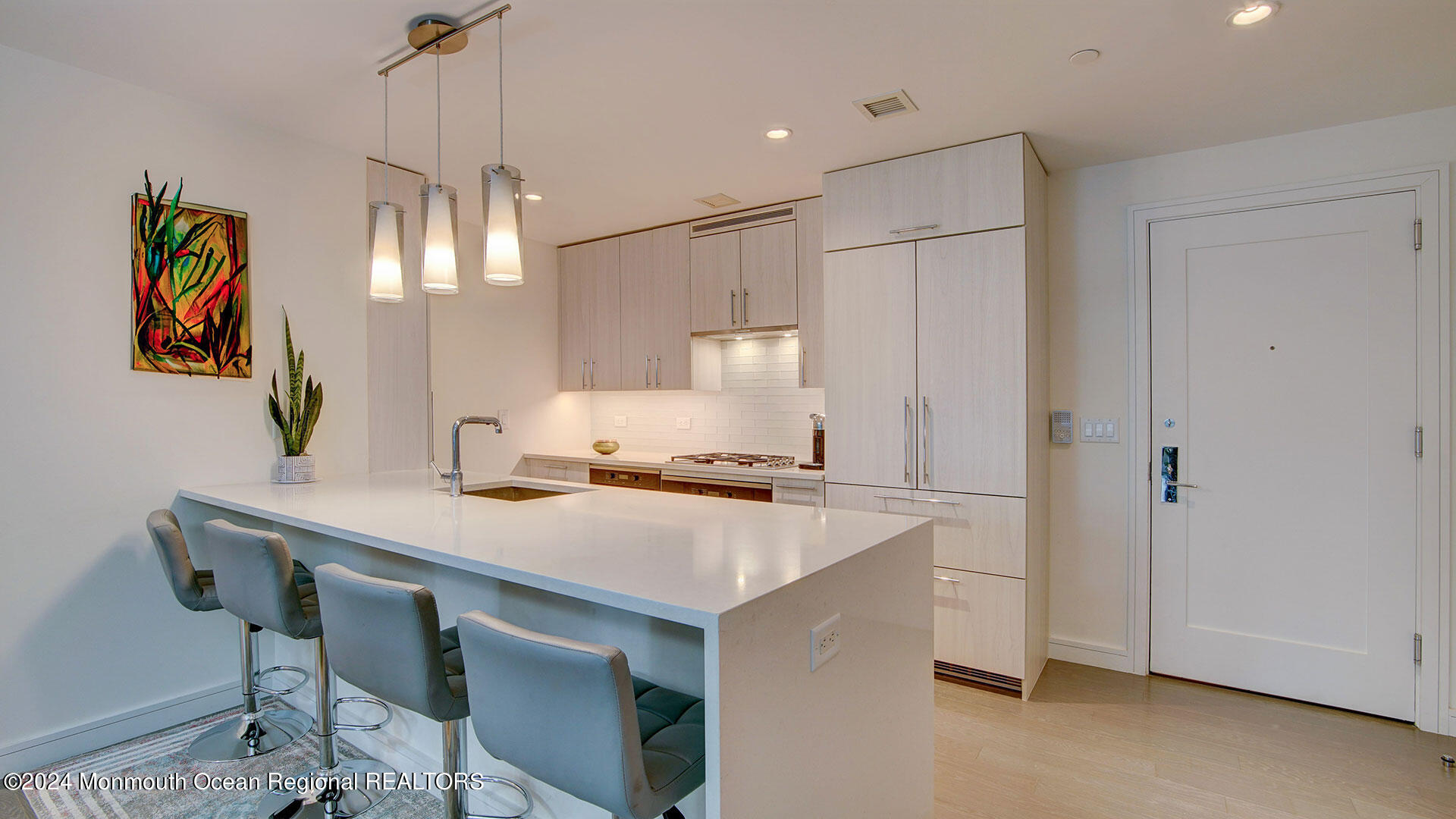 15 Morris Avenue, Unit 307 Long Branch, NJ 07740 - Photo 8 of 33 a kitchen that has a cabinets a stove and a refrigerator