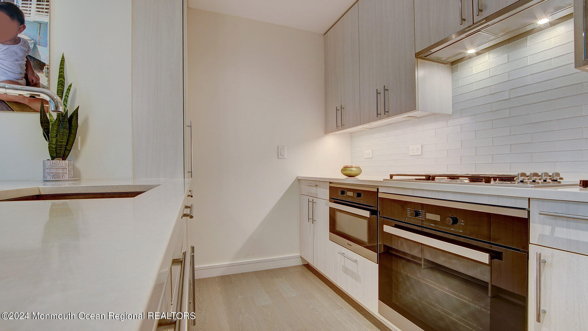 15 Morris Avenue, Unit 307 Long Branch, NJ 07740 - Photo 9 of 33 a stove top oven sitting inside of a kitchen