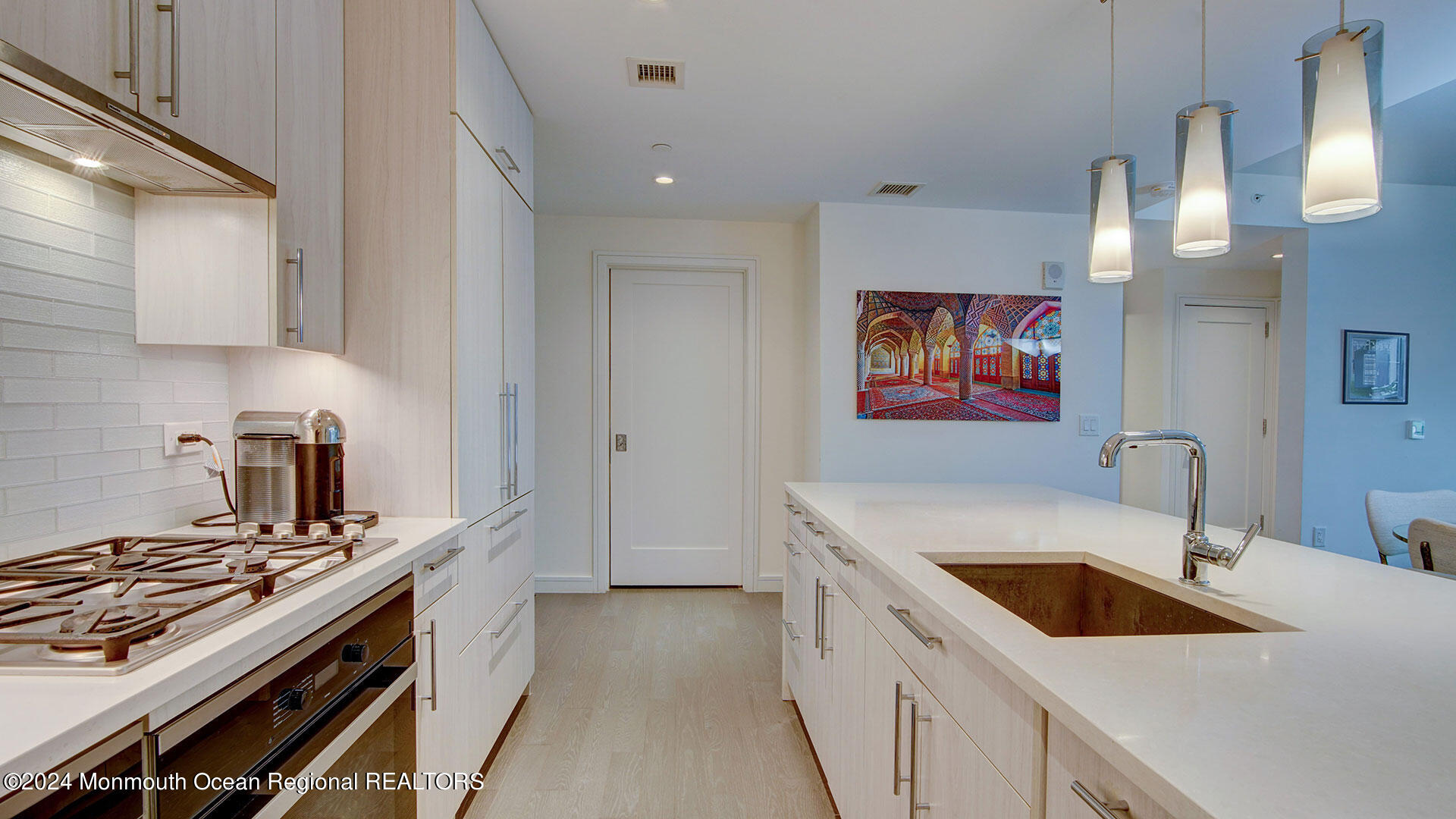 15 Morris Avenue, Unit 307 Long Branch, NJ 07740 - Photo 10 of 33 a kitchen that has a sink and a stove