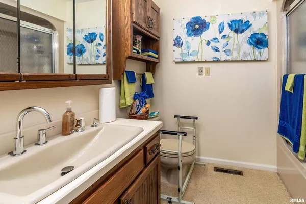 a view of balcony with wooden floor and outdoor seating