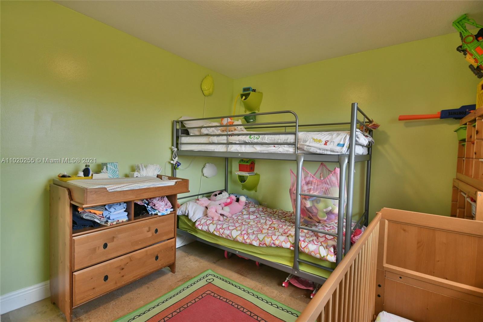 3141 Southwest 27th Terrace, Unit B Miami, FL 33133 - Photo 11 of 15 a bedroom with a bed and a dresser
