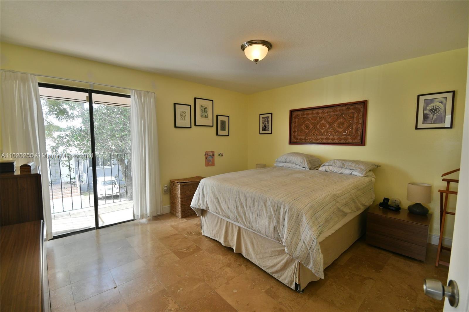 3141 Southwest 27th Terrace, Unit B Miami, FL 33133 - Photo 12 of 15 a spacious bedroom with a bed and a large window