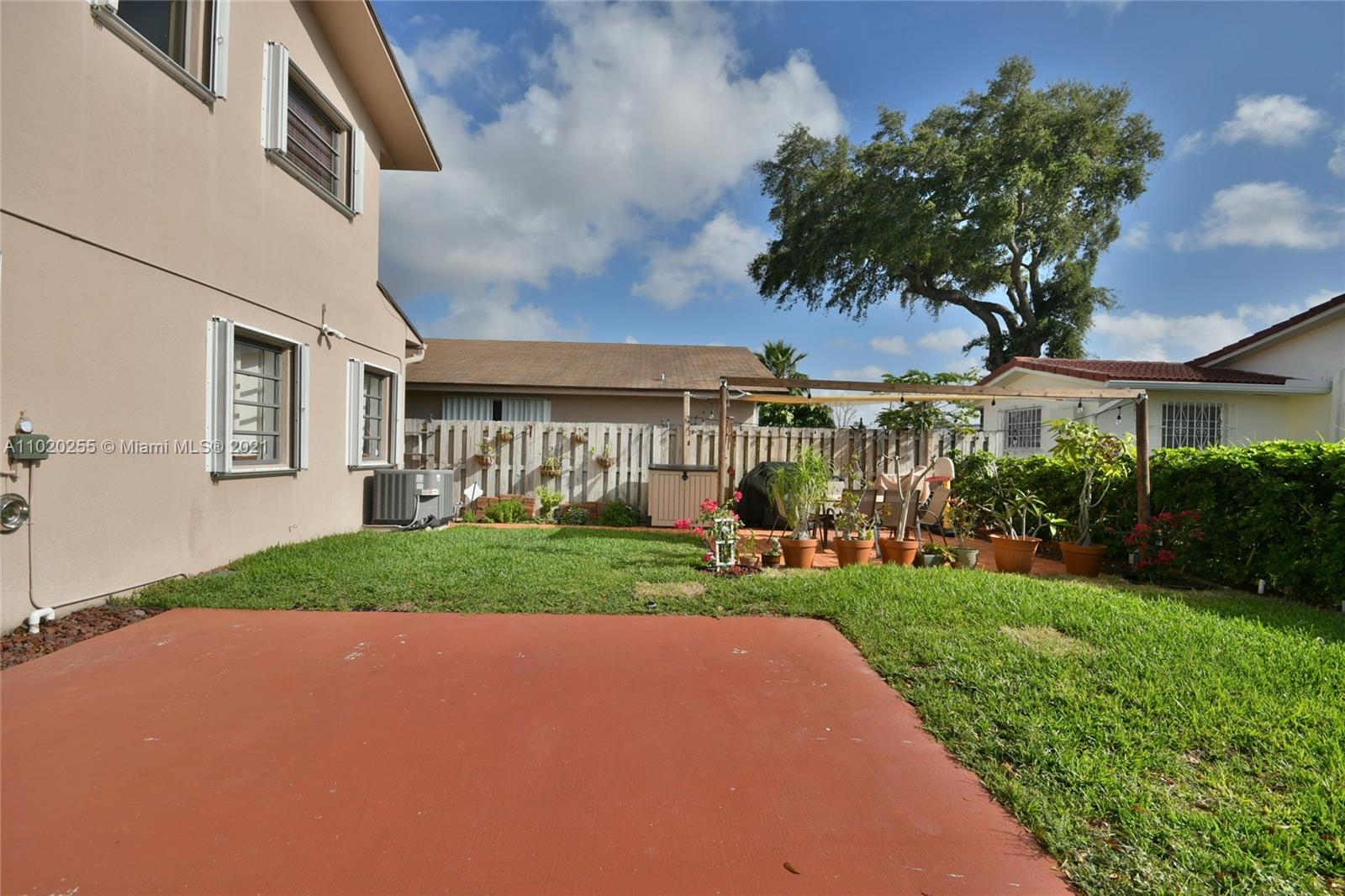 3141 Southwest 27th Terrace, Unit B Miami, FL 33133 - Photo 15 of 15 a view of a house with a big garden and plants