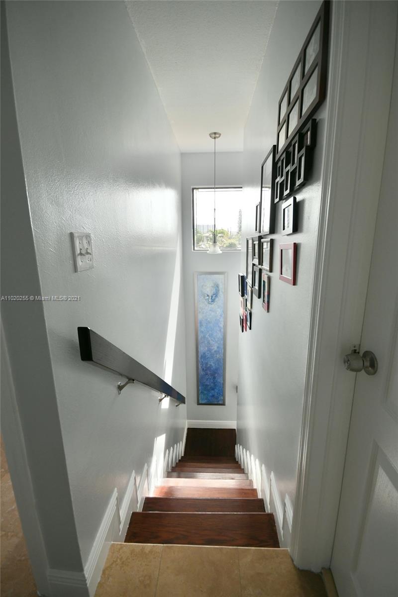 3141 Southwest 27th Terrace, Unit B Miami, FL 33133 - Photo 8 of 15 a view of entryway and hall with wooden floor