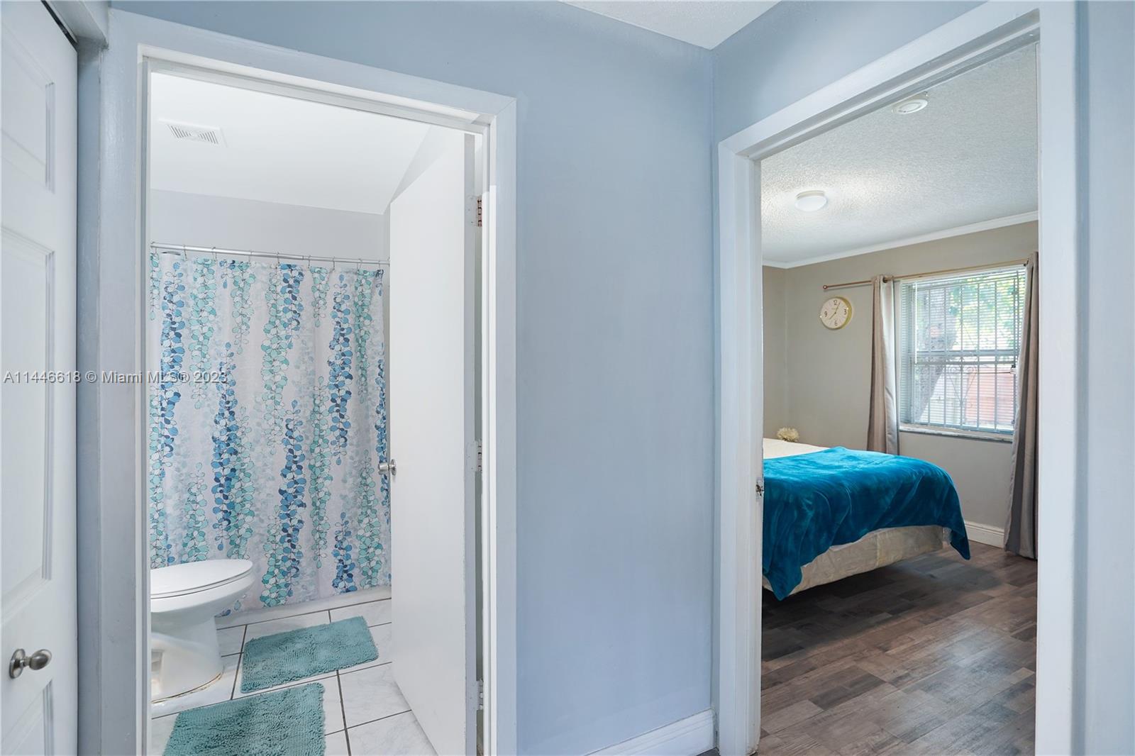 1330 Sesame Street Opa-Locka, FL 33054 - Photo 15 of 27 a en suite bathroom with a toilet sink and shower