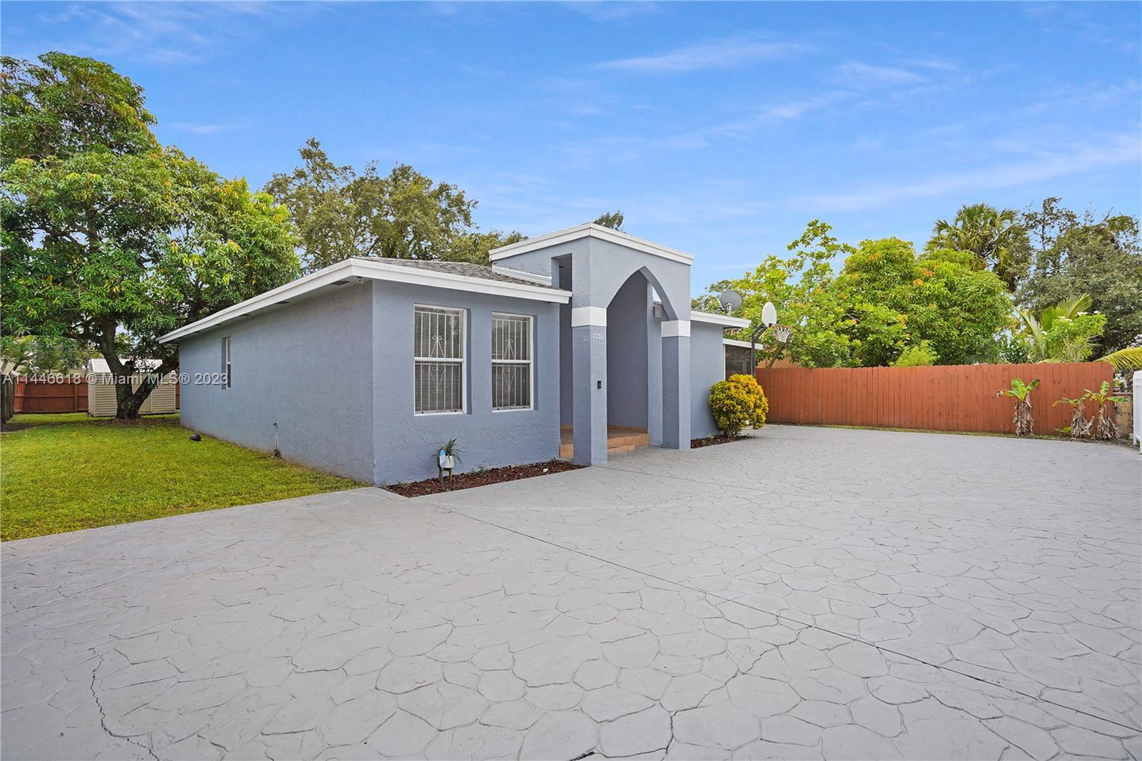 1330 Sesame Street Opa-Locka, FL 33054 - Photo 2 of 27 a backyard of a house with lots of green space
