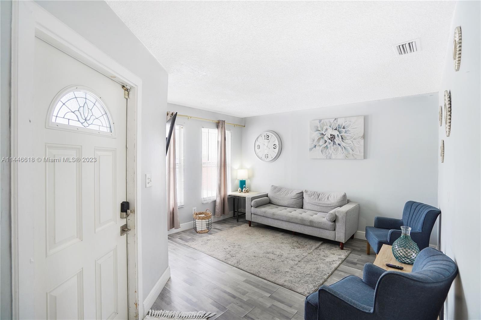 1330 Sesame Street Opa-Locka, FL 33054 - Photo 5 of 27 a living room with furniture and a window