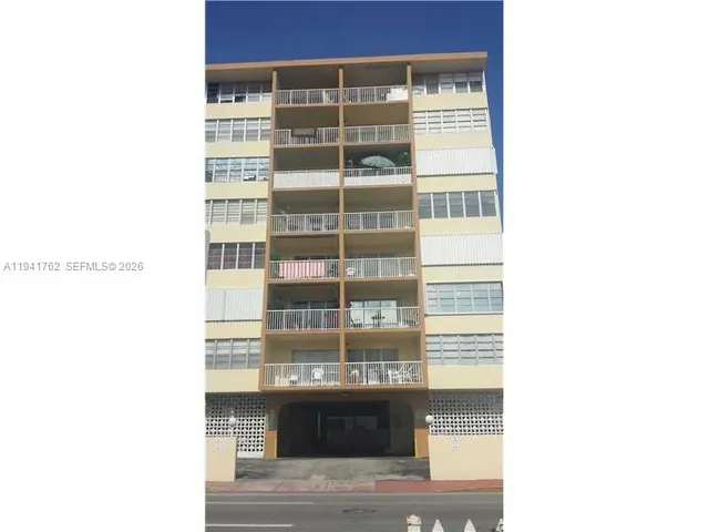 a picture of a bench in front of a window