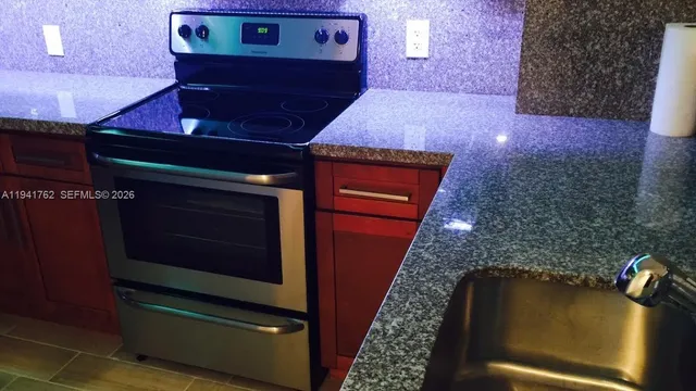 a bathroom with a sink and mirror