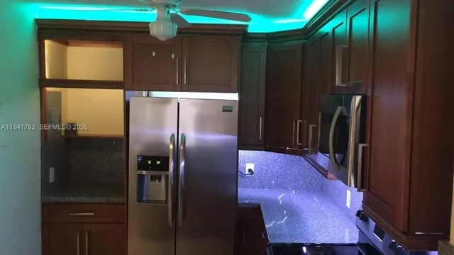 a room with furniture and a large window