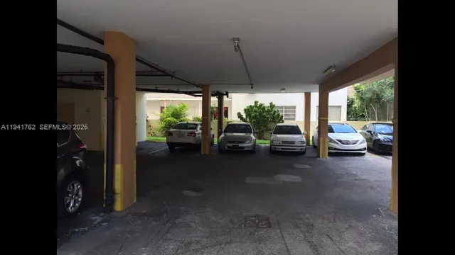 a metallic refrigerator freezer sitting in a kitchen
