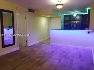 a kitchen with a sink and white cabinets