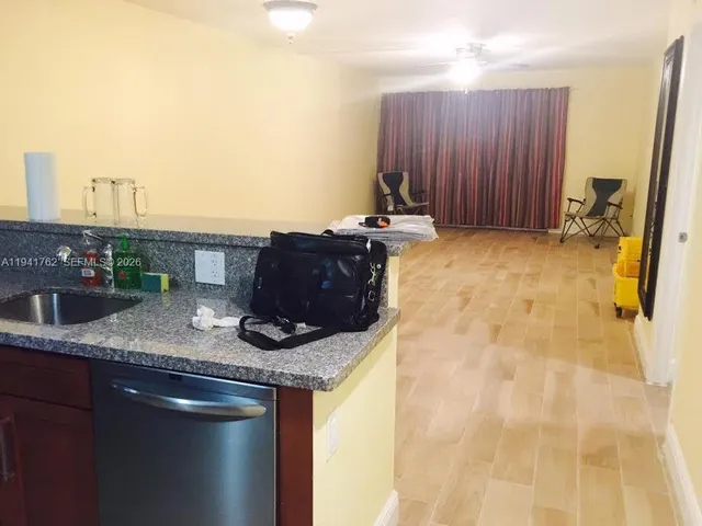 a view of a hallway with wooden shelves