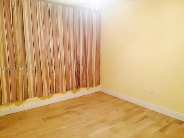 a view of a room with a window