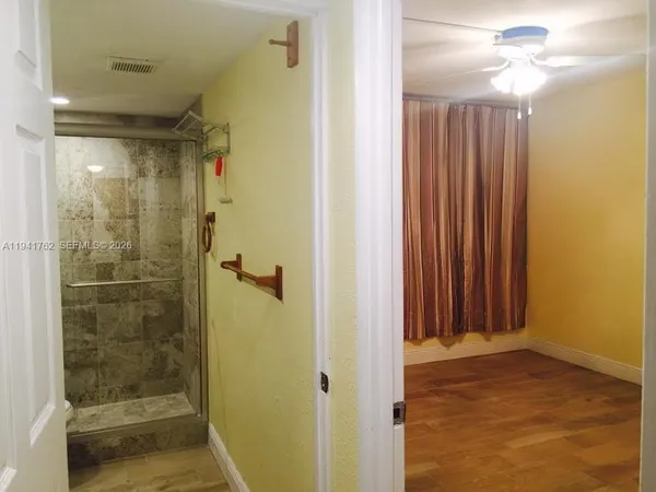 a picture of a bench in front of a building