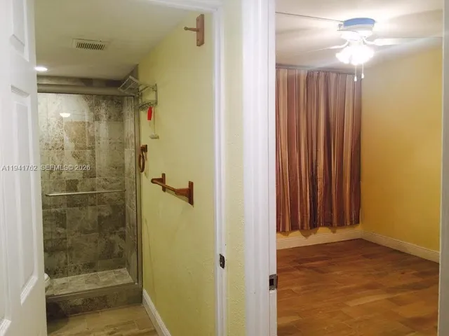 a picture of a bench in front of a building