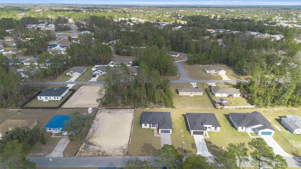 5227 Southwest 165th St Road Ocala, FL 34473 - Photo 32 of 37 an aerial view of residential houses with outdoor space