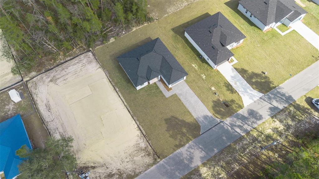 5227 Southwest 165th St Road Ocala, FL 34473 - Photo 35 of 37 a view of a swimming pool with wooden floor