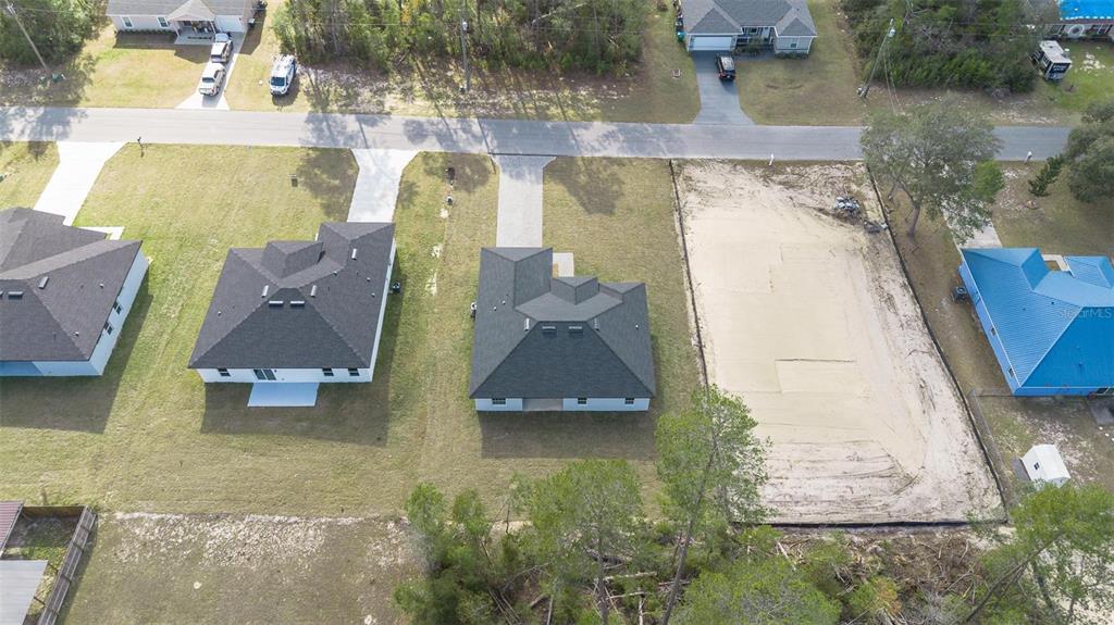 5227 Southwest 165th St Road Ocala, FL 34473 - Photo 36 of 37 an aerial view of residential houses with outdoor space