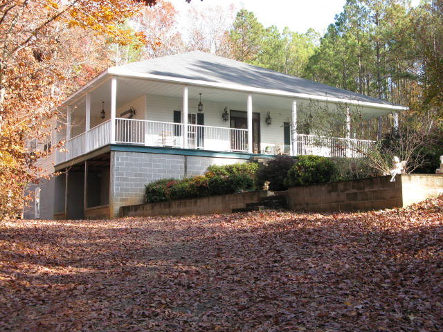 30 Chambless Road, Unit 4 Forsyth, GA 31029 - Photo 1 of 1 a front view of a house with a yard and potted plants