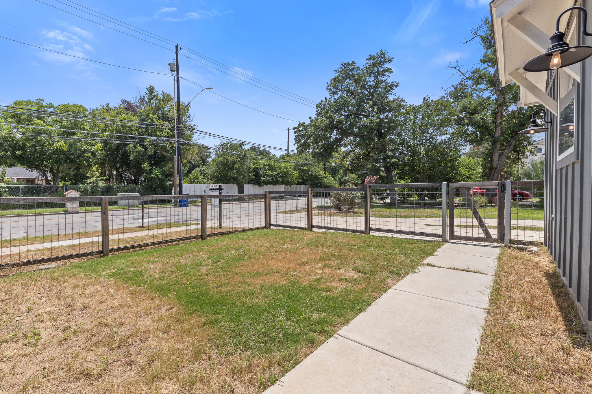 2604 Wheless Lane, Unit 1 Austin, TX 78723 - Photo 3 of 38 Fenced perimeter ensures safety and privacy—perfect for families with children or pet owners.