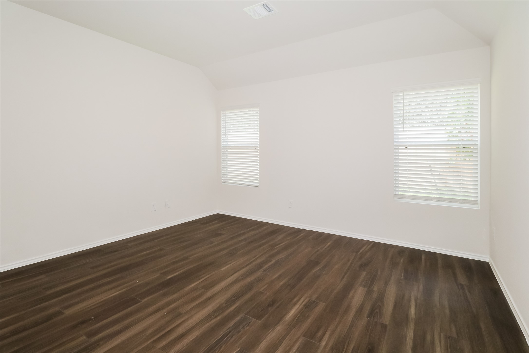 2146 Middle Rdg Drive Conroe, TX 77301 - Photo 10 of 21 a view of an empty room with wooden floor and a window