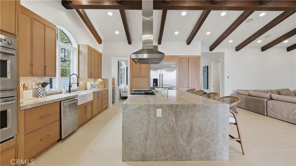 a large kitchen with kitchen island granite countertop lots of counter top space