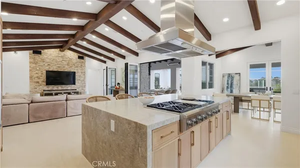 a kitchen that has a stove and a table in it