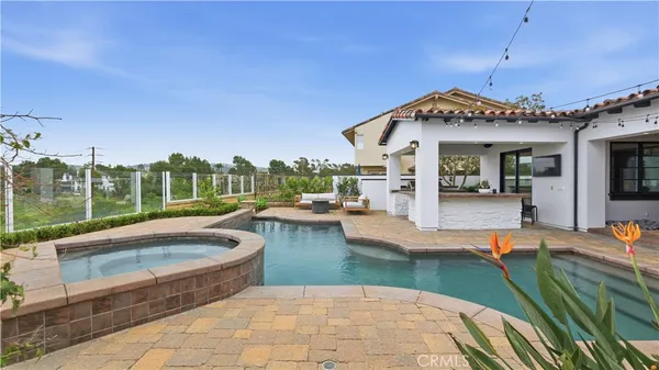 a view of a house with swimming pool